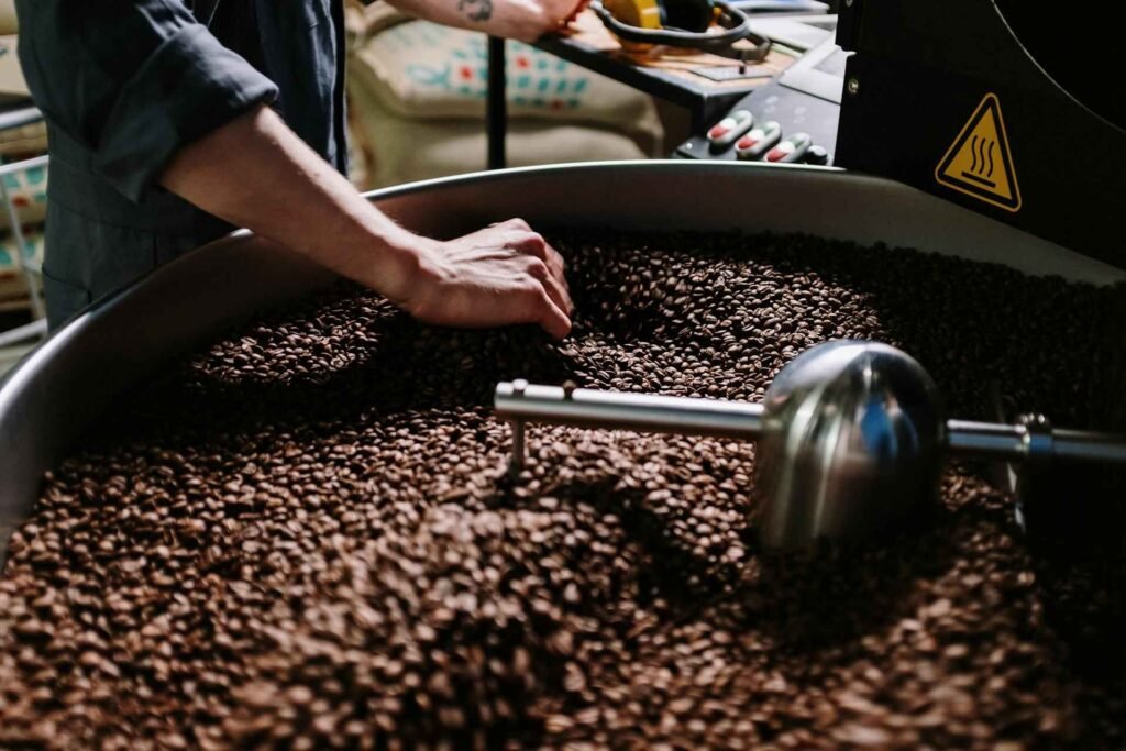 roaster tending to coffee beans