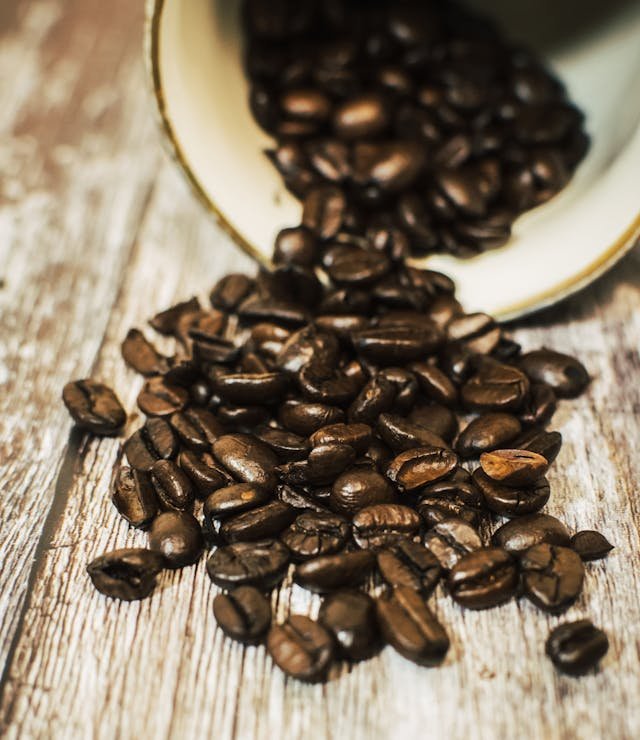 coffee beans coming out of a cup